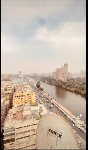 شقه فندقيه ملوكي تطل على النيل بالعجوزة